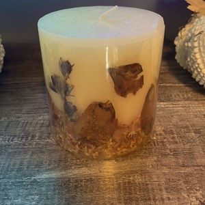 Beautiful candle with dried flowers